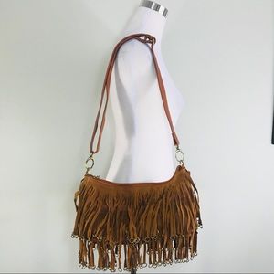 Camel tassel fringed with long adjustable strap.